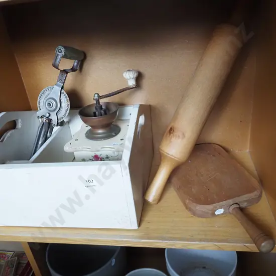 bay of kitchen items; rolling pin, egg beater etc