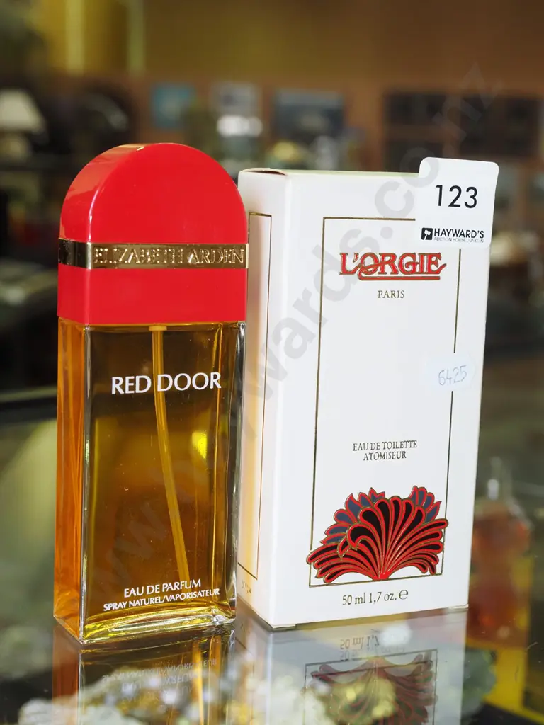 boxed L'Orgie eau de toilette (partial contents) - some staining to box, Elizabeth Arden Red Door Image 1++