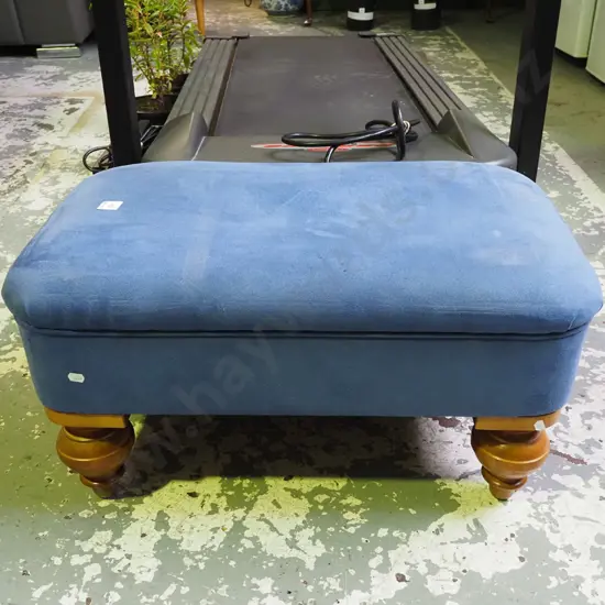 blue upholstered footstool
