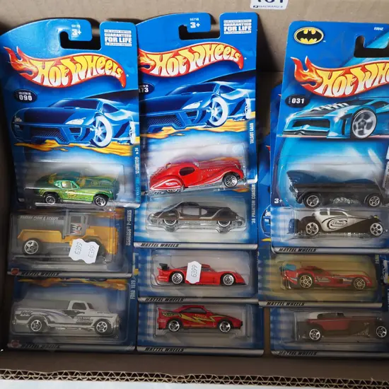 box of carded Hotwheels vehicles