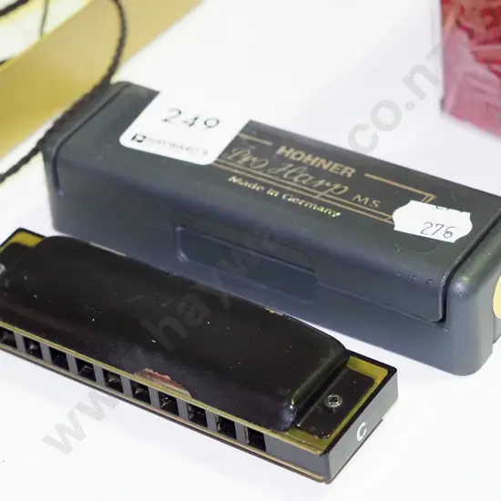 cased Hohner harmonica