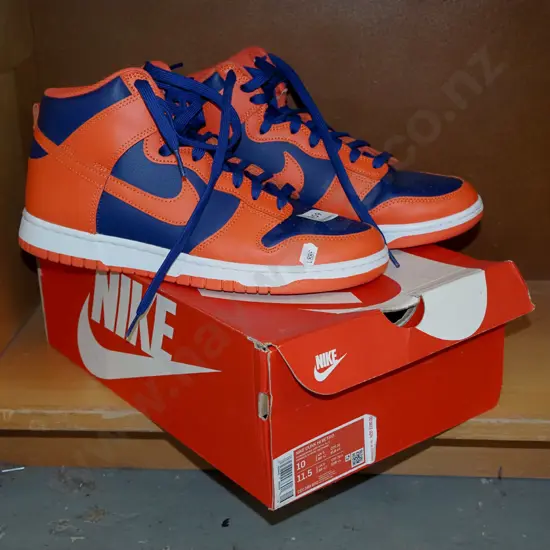 pair of Nike size 10 hightop basket ball sneakers