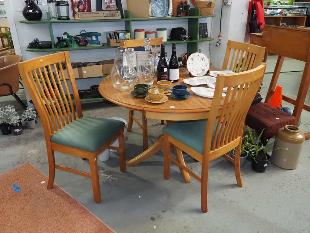 solid rimu and mdf veneer circular pedestal dining table wth 2x extending drop sides and 4  Image 1++