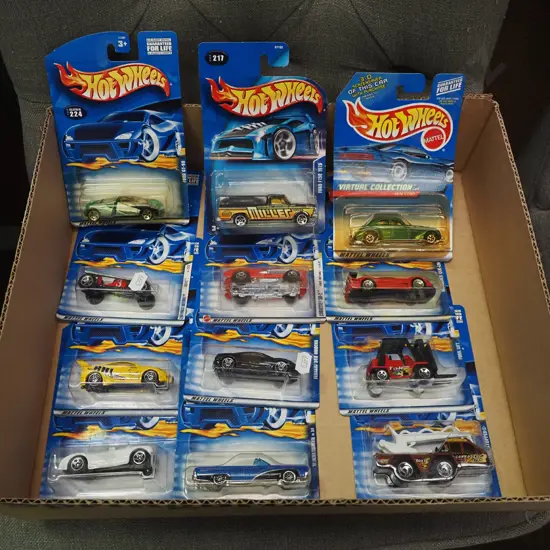 box of carded Hot Wheels die-cast vehicles