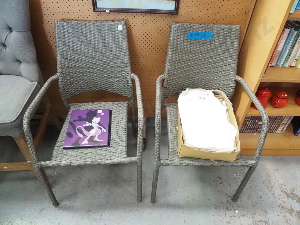 pair of woven plastic outdoor armchairs Image 1++