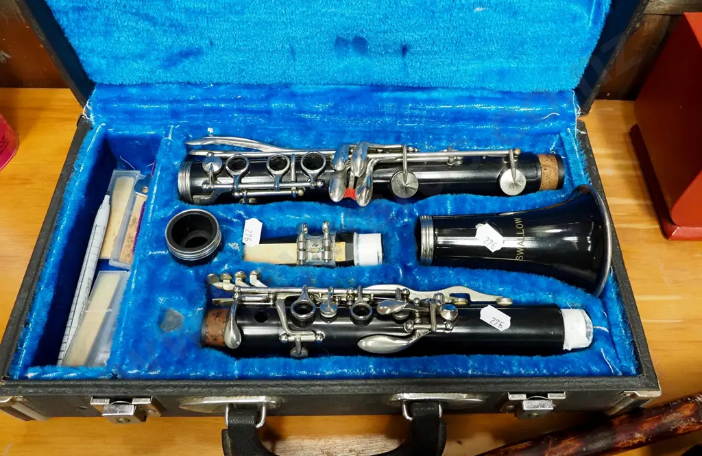 cased Swallow brand clarinet and a walking stick Image 1++