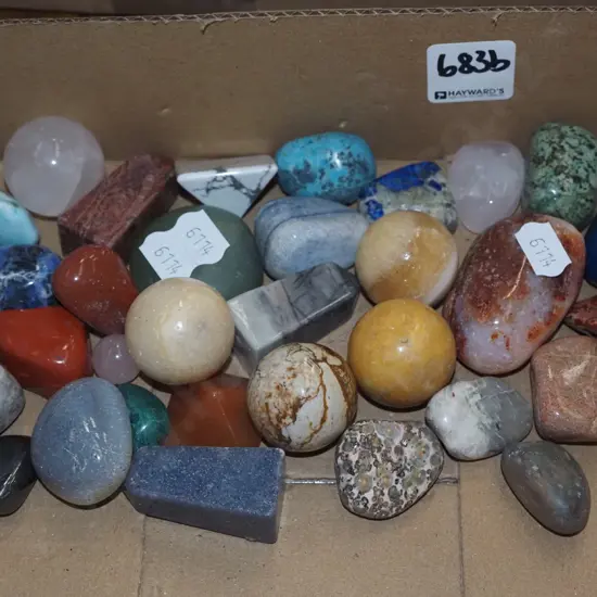 box of various polished stones
