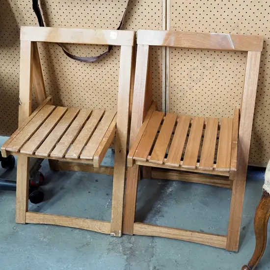 pair of hardwood outdoor folding chairs