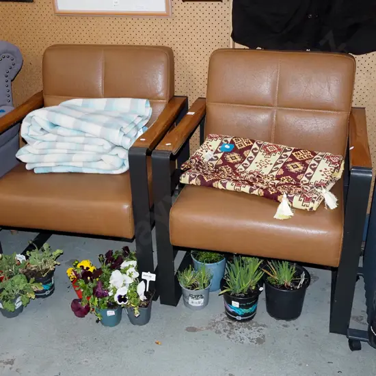 pair of brown vinyl metal and wood reception chairs