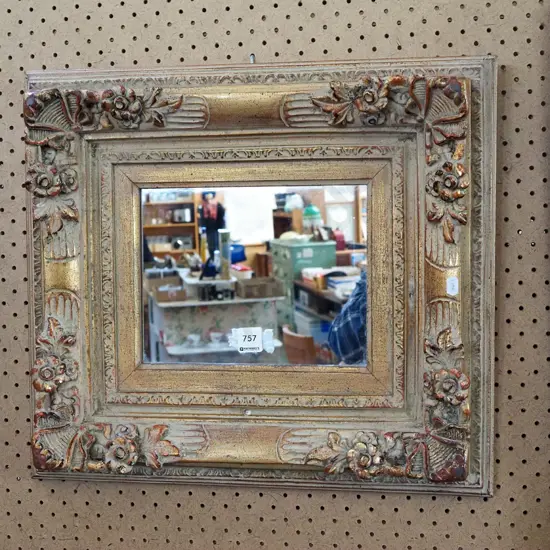 ornate gilt framed mirror