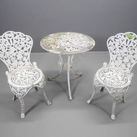 white painted cast aluminium Victorian style outdoor table and 2 chairs - has paint loss. Table H-680 Diameter 660