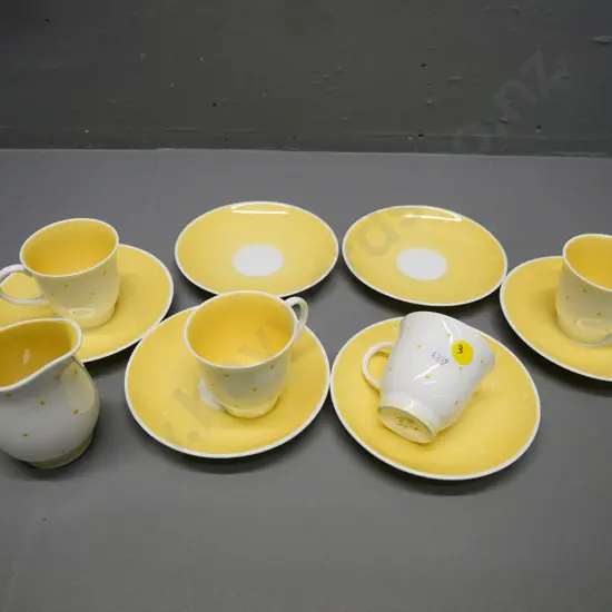 Susie Cooper yellow and white polka dot coffee ware - 4 cups, 6 saucers, cream jug - stains to outside base of 1 cup