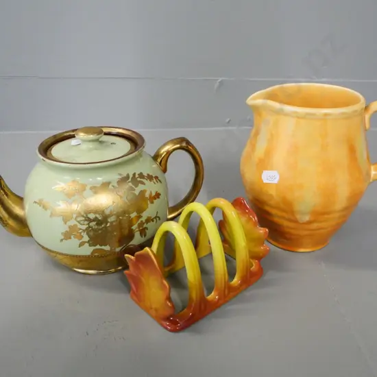 Beswick jug, Carlton ware toast rack, and a gold and green teapot