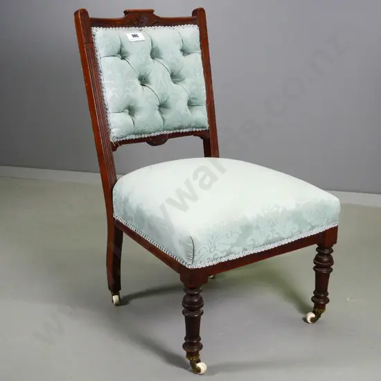 Edwardian nursing chair with damask upholstered seat and back on porcelain casters, some joint looseness H760 W450 D450