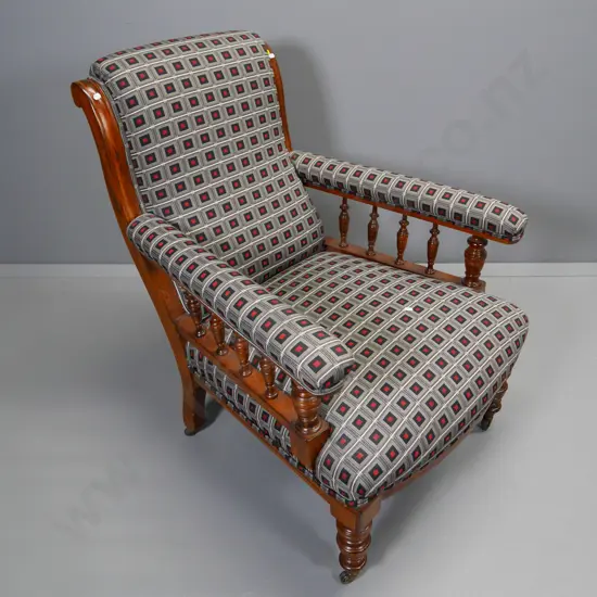 vintage wood-framed armchair w/turned legs & spindle sides, metal casters, geometric tapestry upholstery H940 W730 D800