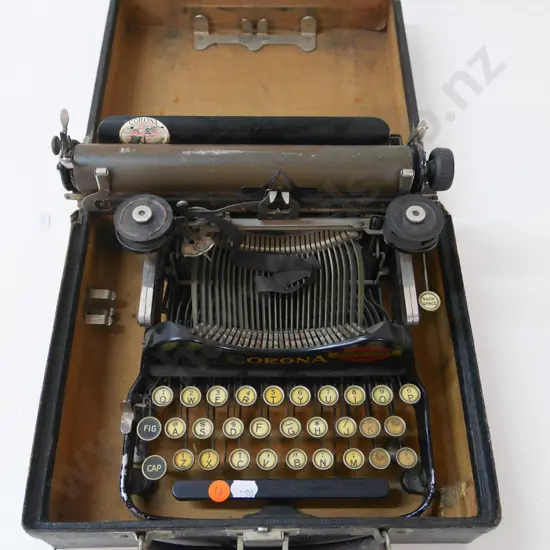 small vintage cased Corona portable typewriter - supplier Johnson & Hardy Dunedin