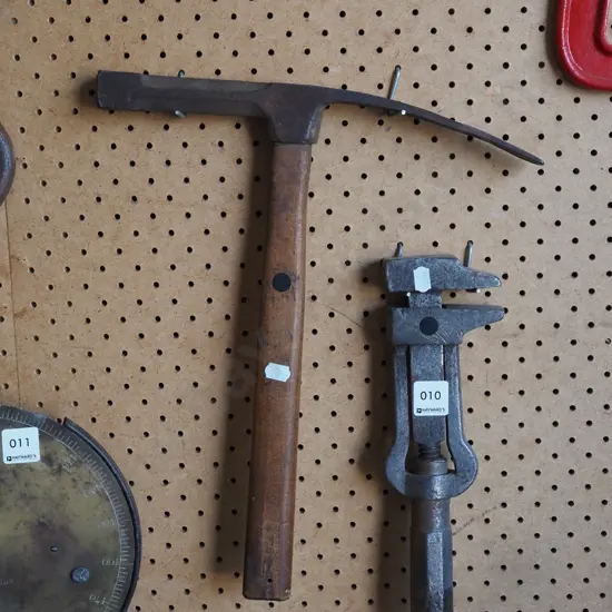 vintage plumber's stilsons, prospector's hammer