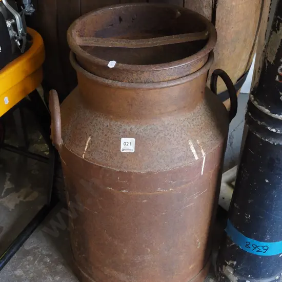large rusty milk pail