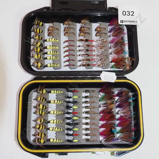 container of fly fishing flies