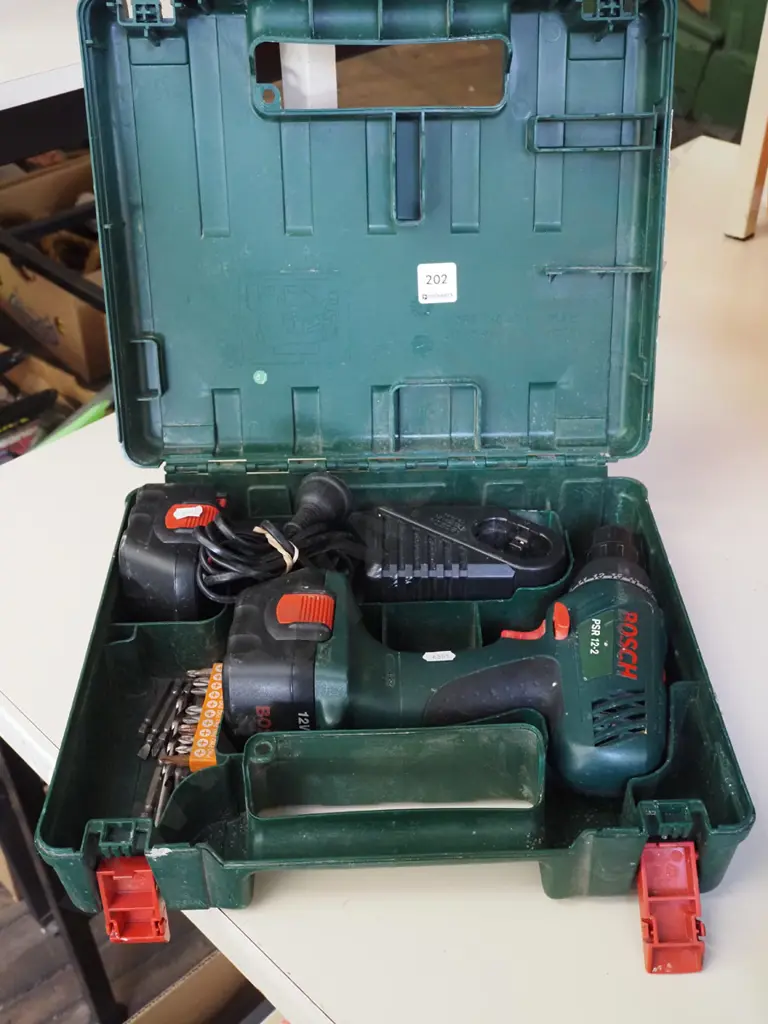 cased Bosch battery drill- batteries in office Image 1++