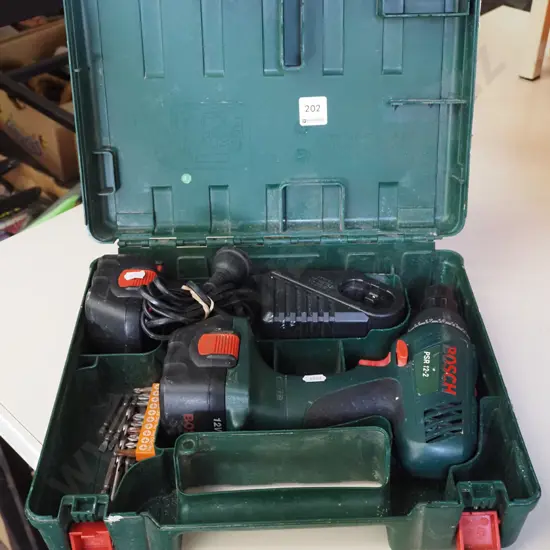 cased Bosch battery drill- batteries in office