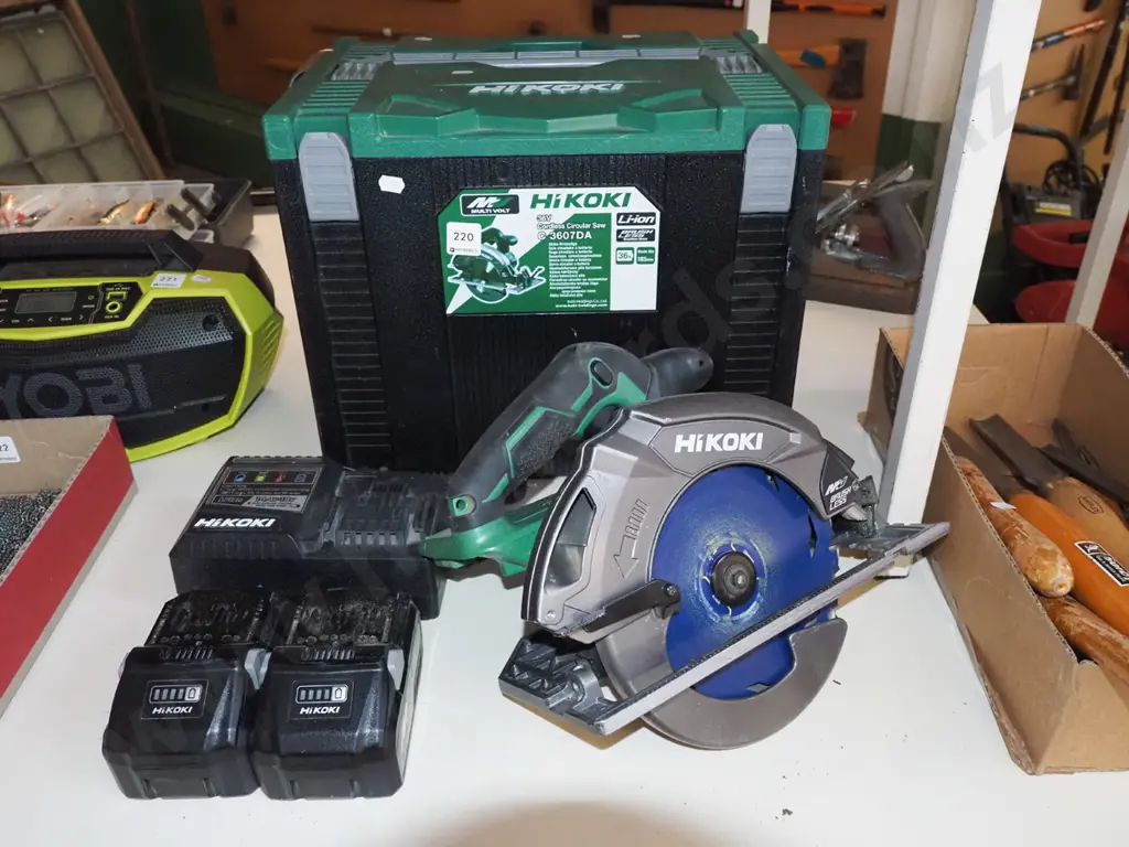 Hikoki battery powered skilsaw with carry case, charger, 2x batteries - batteries in office Image 1++