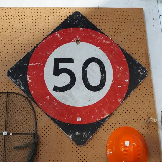 decommissioned 50 km/hr road sign
