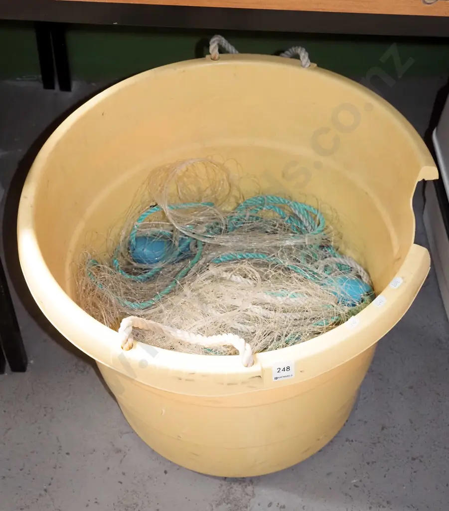 yellow plastic bucket and fishing net Image 1++