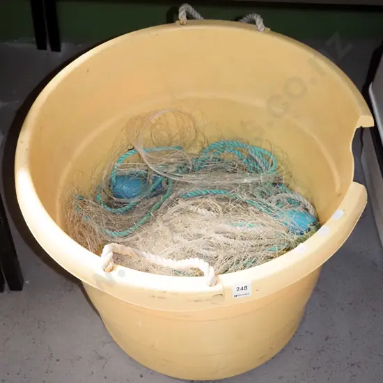 yellow plastic bucket and fishing net