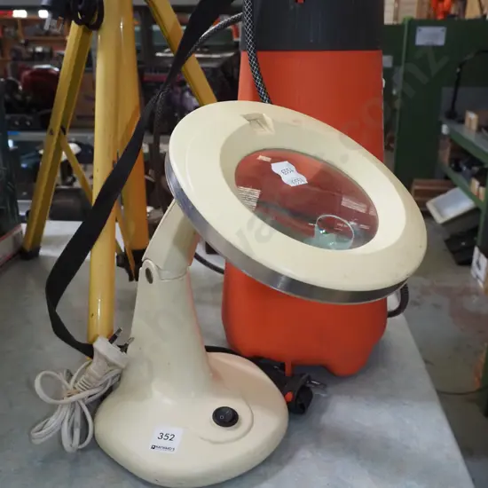 illuminated magnifying glass on stand