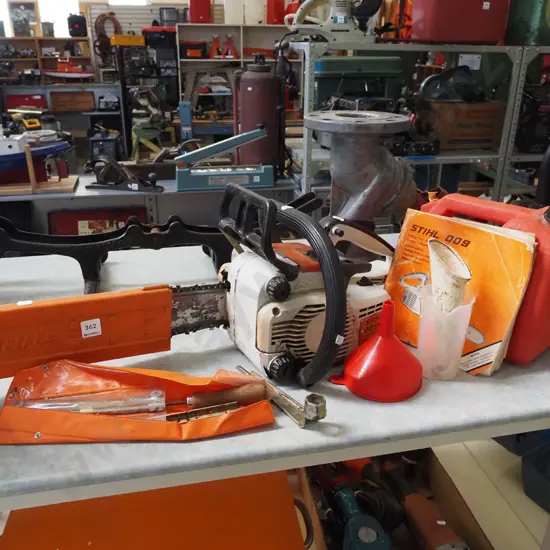 Stihl 009 chainsaw with petrol container and other accessories