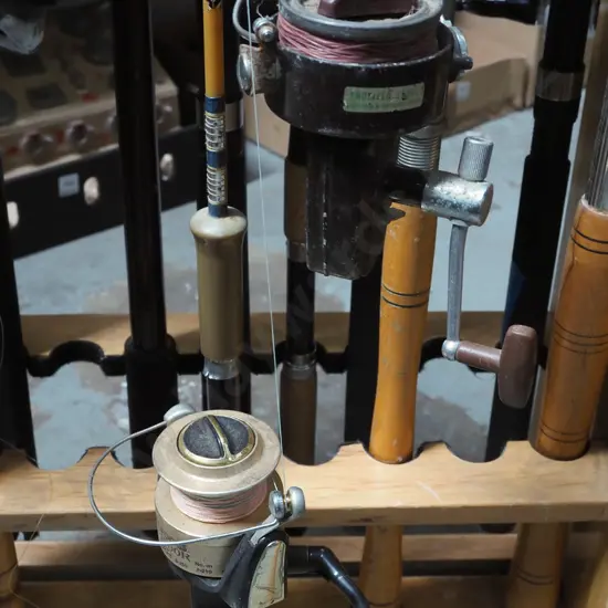 2x fishing rods and reels - red dots