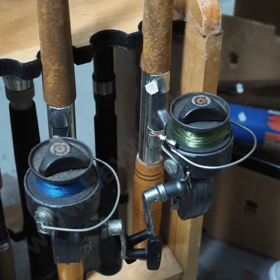 2x fishing rods and reels - yellow dots