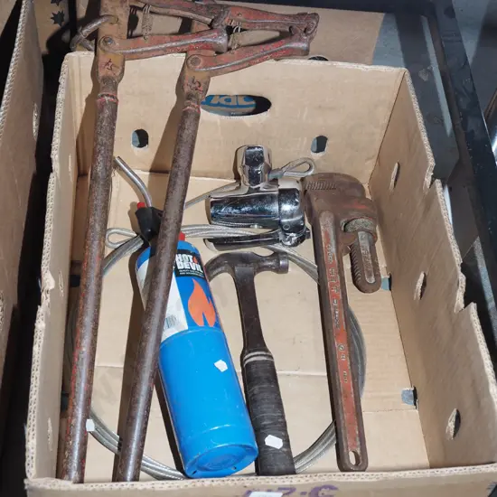 box; stilsons, hammer, wire strainers etc