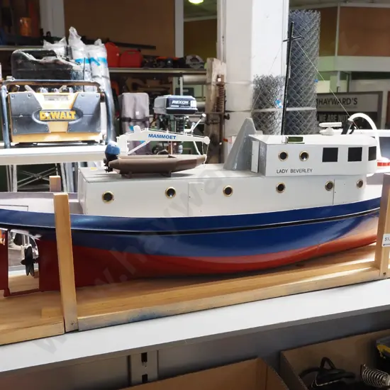 large motorised model boat - marked Lady Beverley, with crane arm and inflatable boat. Motor untested.