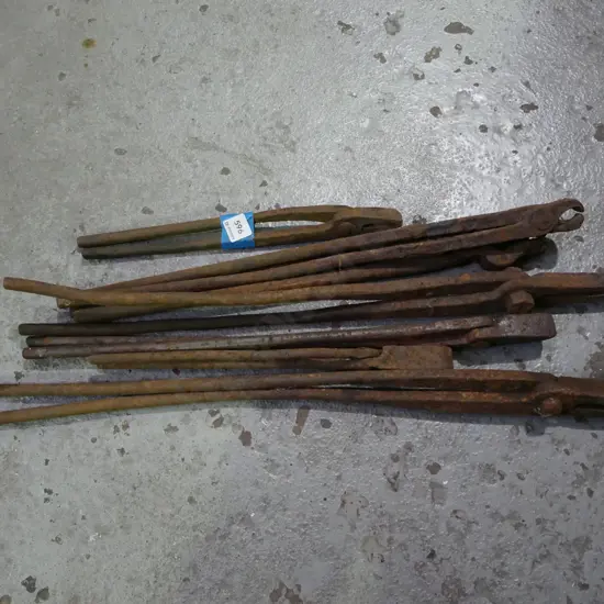 bundle of rusty blacksmith tongs
