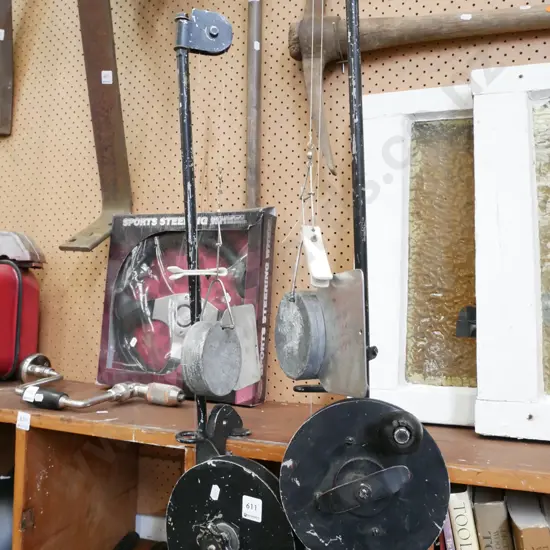 pair of vintage plumb bobs and reels