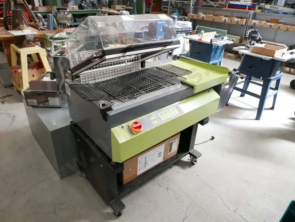 commercial heat shrink wrapping machine with additional roll of wrap Image 1++