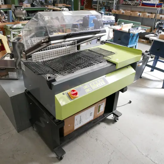 commercial heat shrink wrapping machine with additional roll of wrap