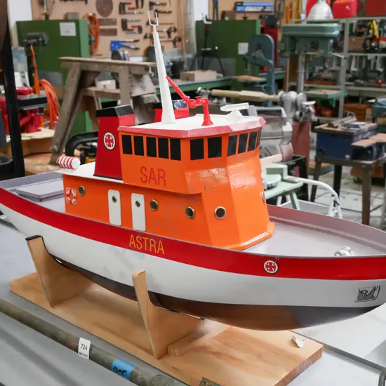 large motorised model boat - marked SAR & Astra, replica of Swedish search and rescue ship, on wooden stand, loose mast