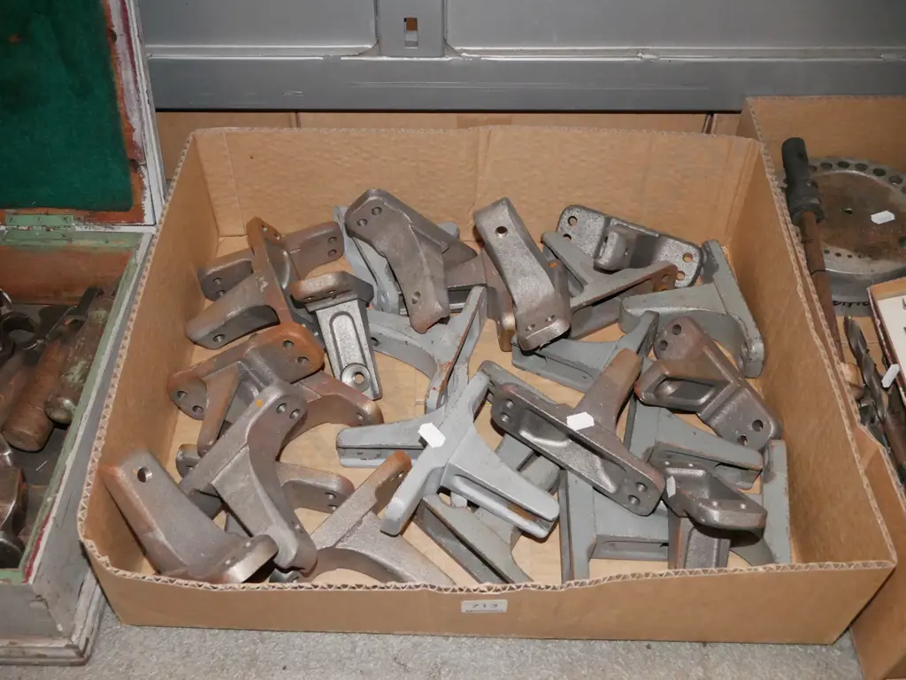 box of cast metal brackets Image 1++
