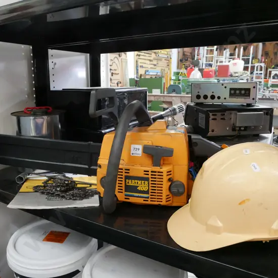 Partner chainsaw with hard hat, fuel can, chain etc