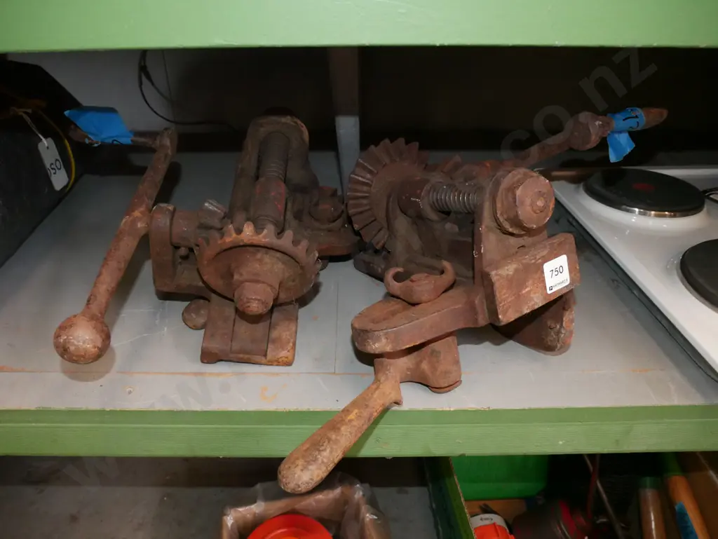 pair of rusty floor clamps Image 1++