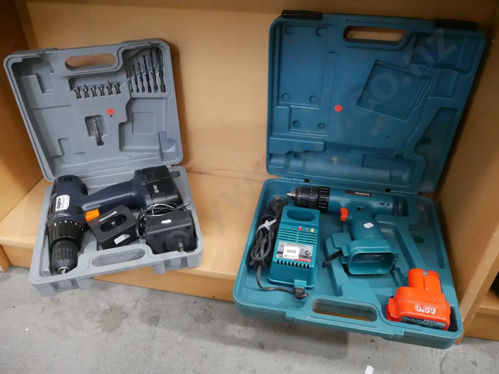 2x cased battery drills- batteries in office - red dots Image 1++