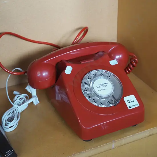 red plastic dial telepone