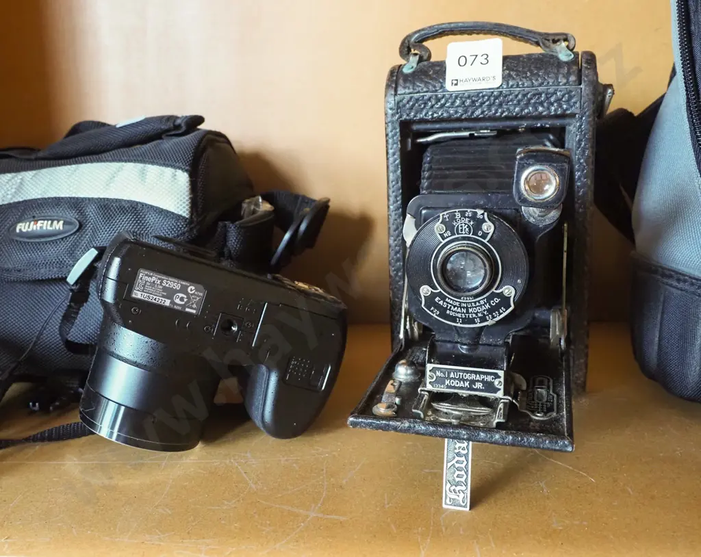 Fujifilm digital camera, vintage Kodak folding camera, Canon camera bag Image 1++