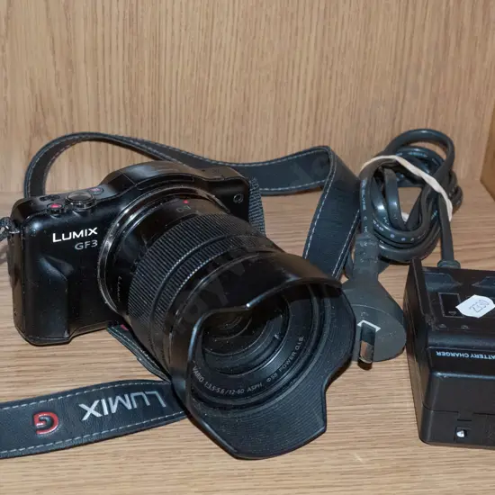 Panasonic Lumix GF3 digital mirrorless camera with charger and 12-60mm zoom lens