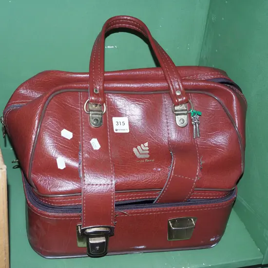 cased Taylor lawn bowls