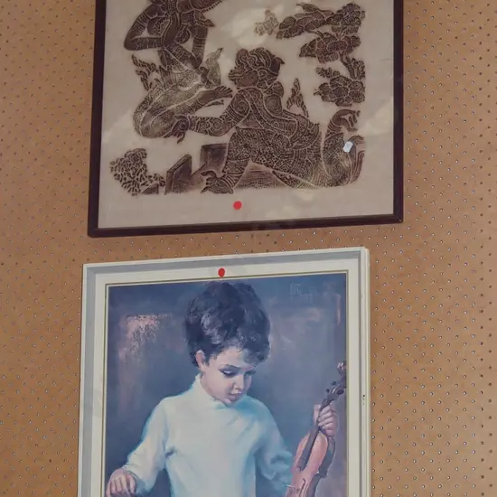 Indonesian temple rubbing, framed print - boy and violin - red dots