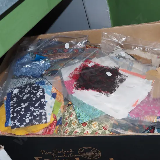 box of fabric pieces